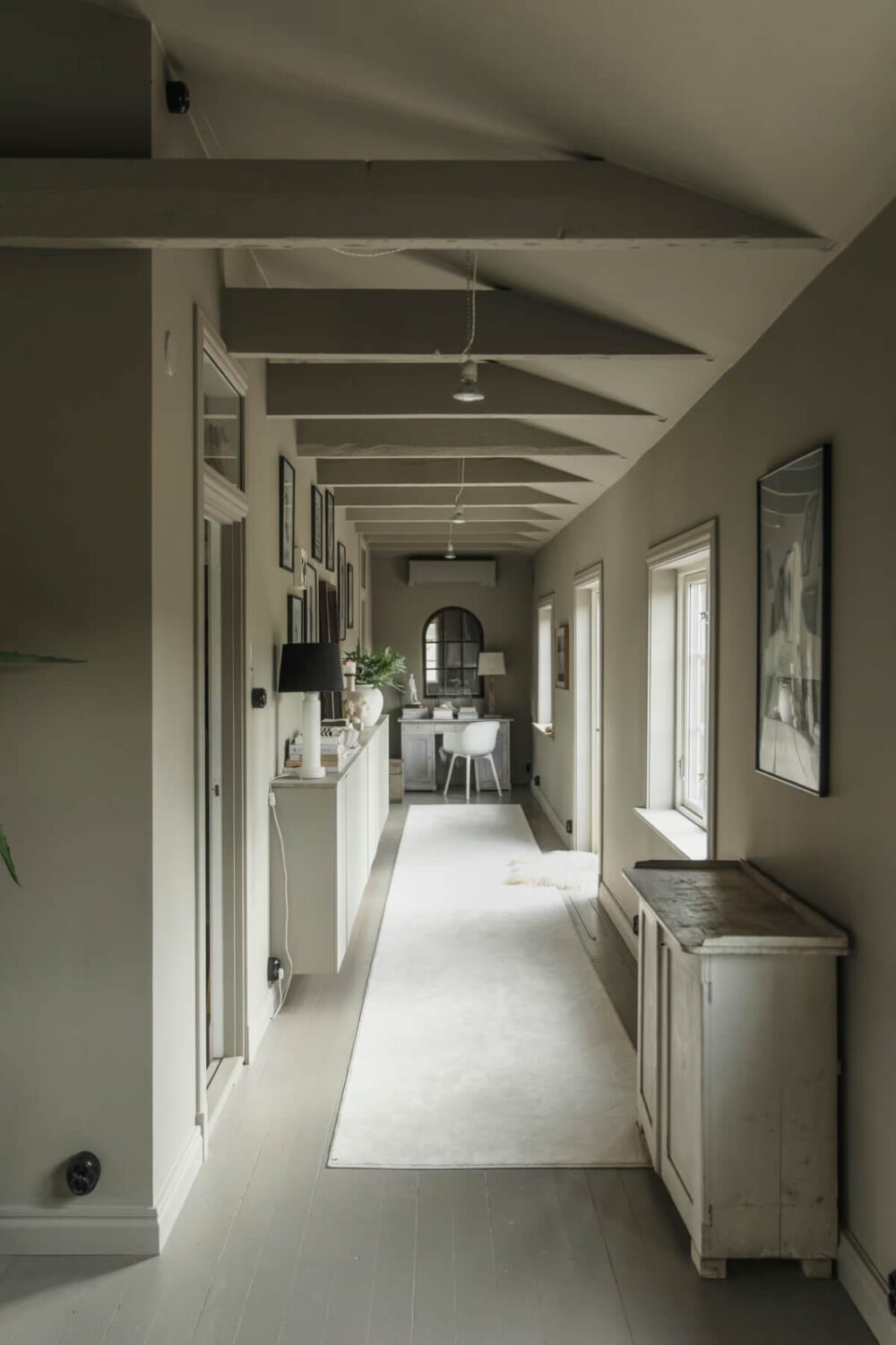 An Open-Plan Gray Home in a Former Textile Factory 11 gray hall with cabinets and desk