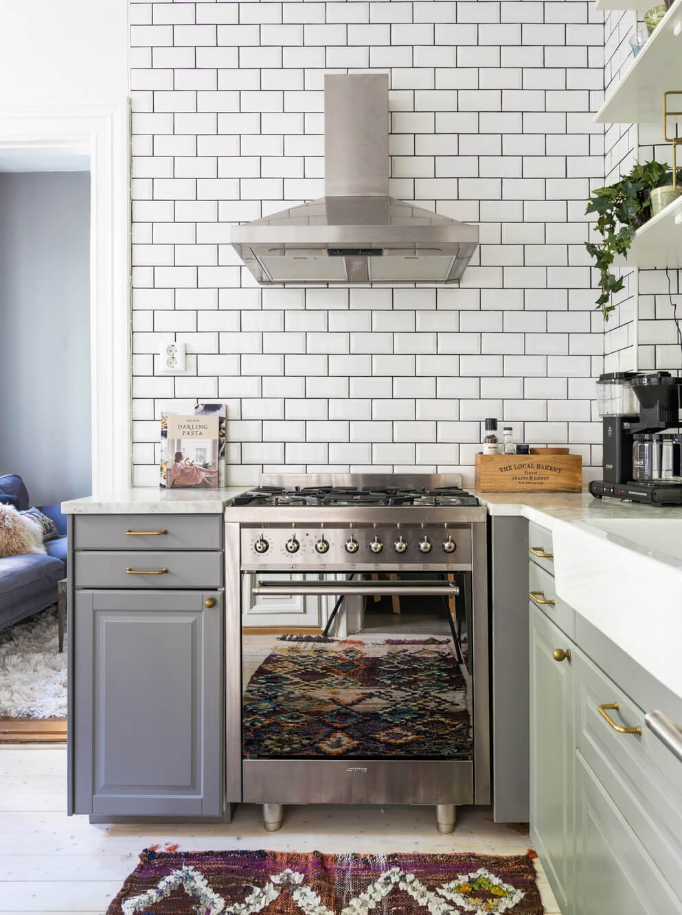 Classic Proportions and a Charming Kitchen in a Malmö Apartment 6 gray kitchen brass fittings white metro tiles
