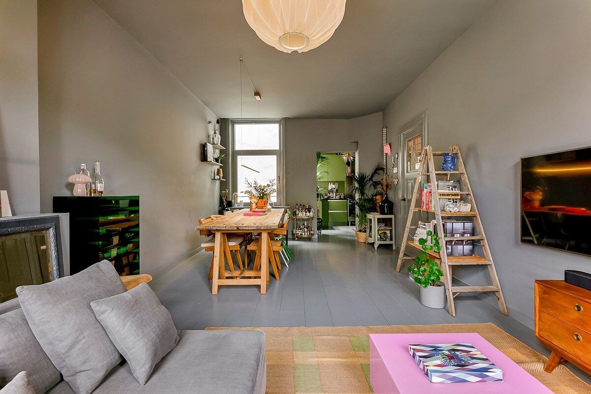 An Amsterdam Apartment with Surprising Bold Color Accents 2 gray living room with dining table