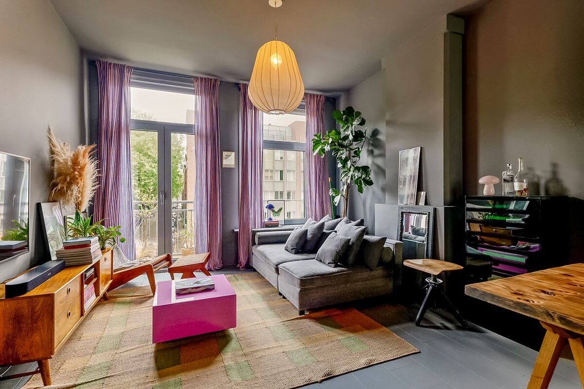 An Amsterdam Apartment with Surprising Bold Color Accents 1 gray living room with pink colors accents nordroom