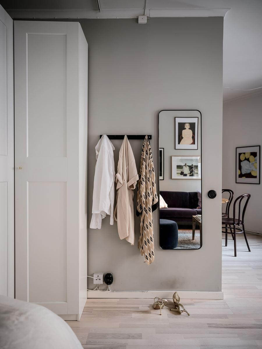 A Cozy Monochrome Gray Studio Apartment 7 gray studio apartment wardrobes mirror nordroom