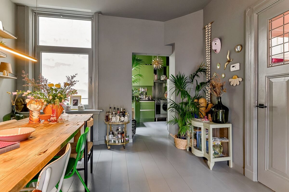 An Amsterdam Apartment with Surprising Bold Color Accents 6 gray walls and floorboards living room