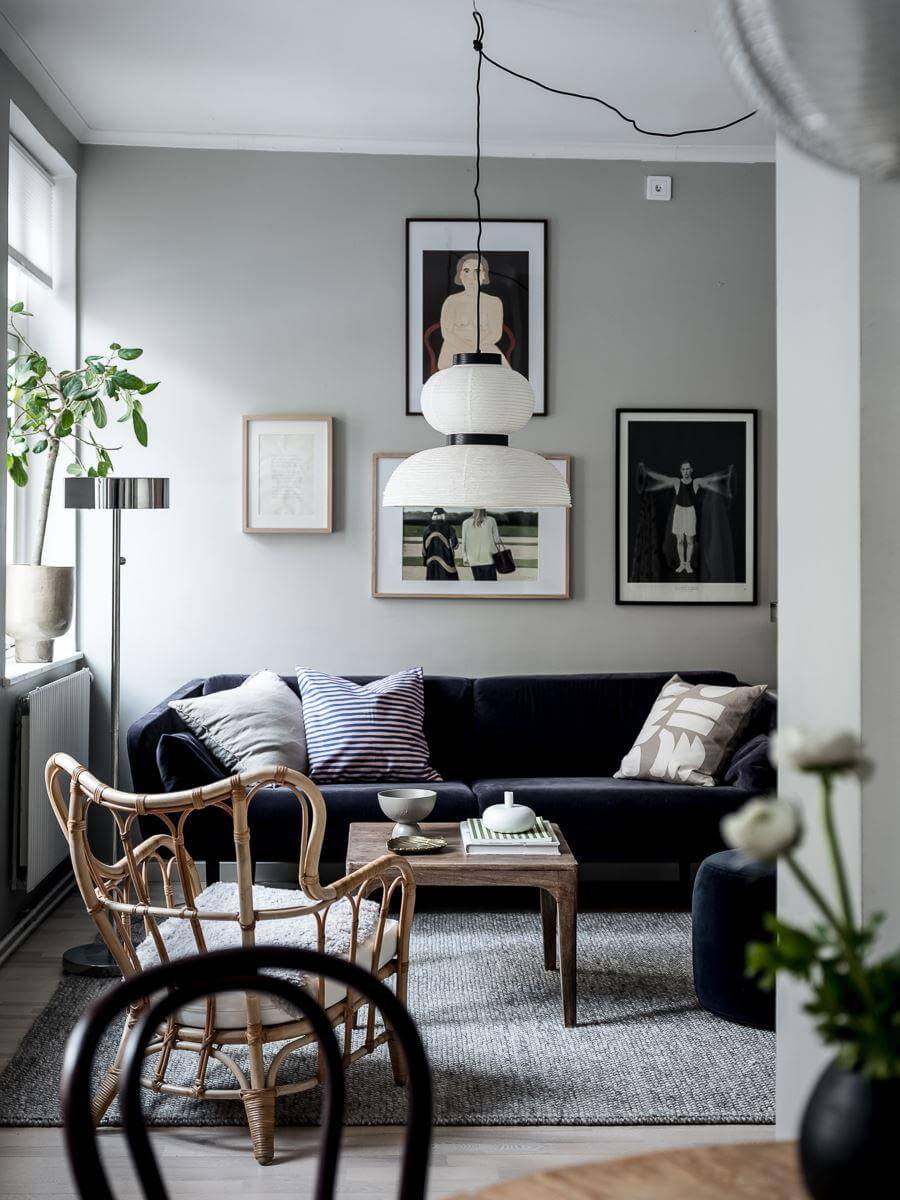 A Cozy Monochrome Gray Studio Apartment 3 gray walls purple sofa scandinavian studio apartment nordroom
