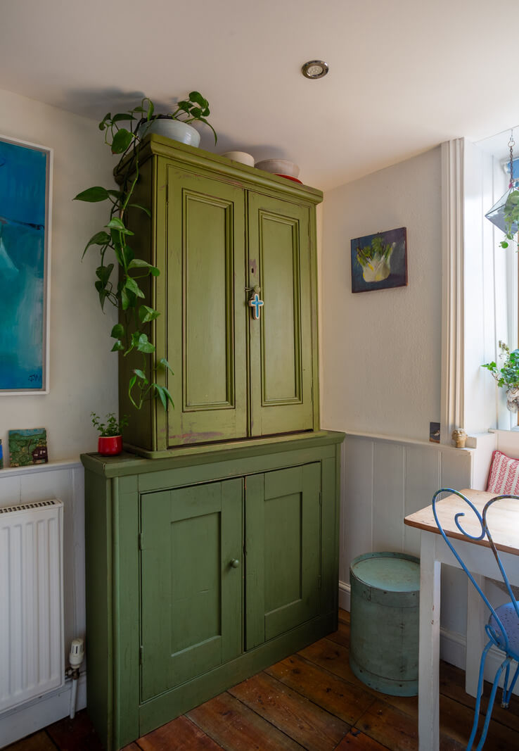 A Charming 400-Year-Old Cottage in England 8 green cabinet A Charming 400-Year-Old Cottage in England