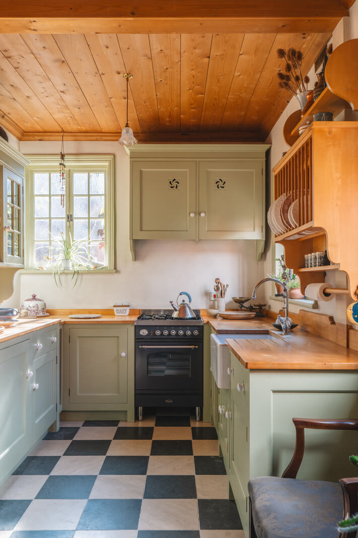 green cottage kitchen timber ceiling checkerboard floor