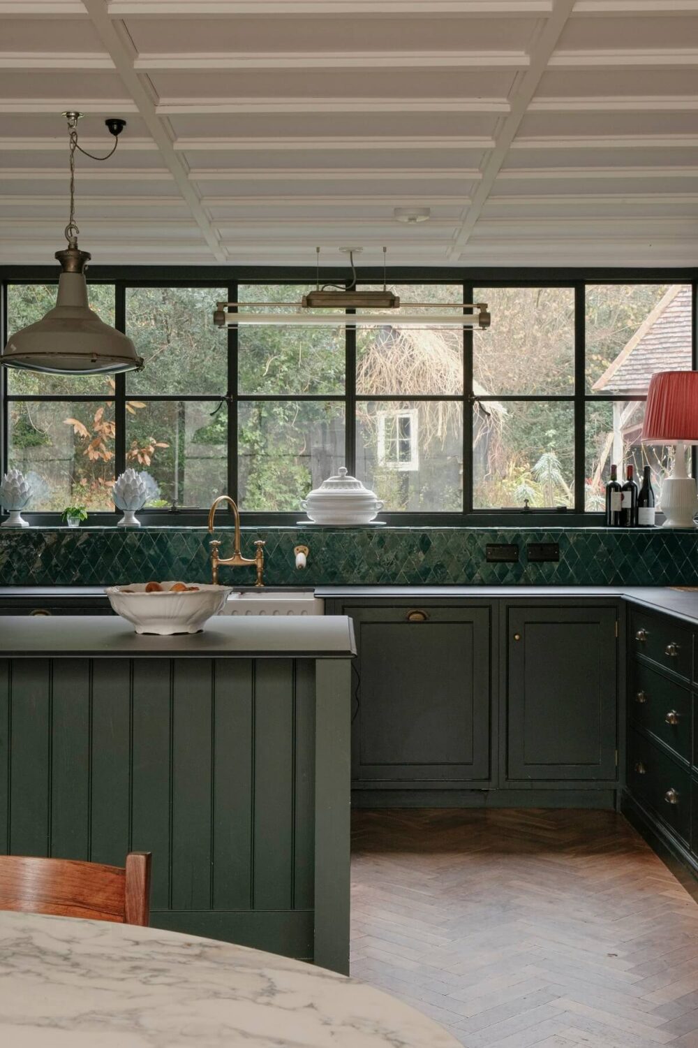A Barn House with Vintage Decor and Exposed Beams 8 green kitchen cabinets and tiles with industrial style windows