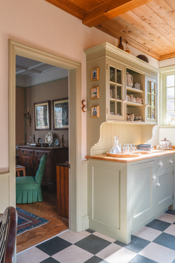 A Sage Green Kitchen in a Charming Arts and Crafts House 8 green kitchen timber ceiling checkerboard floor