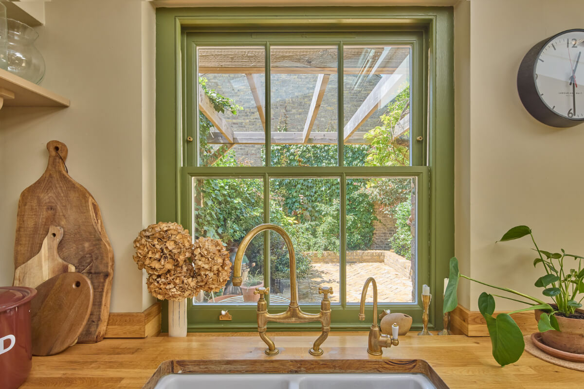 A 19th Century London Cottage with a Stunning Kitchen Extension 7 green kitchen window
