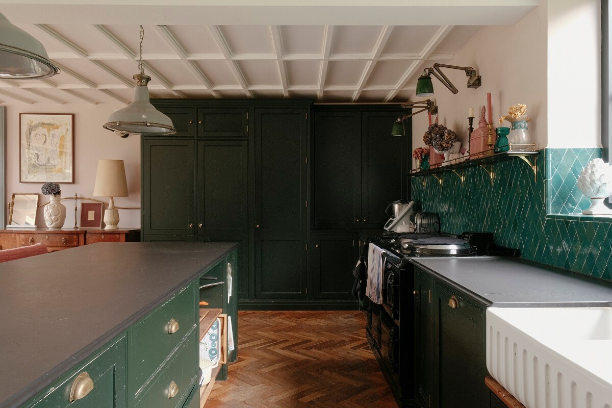 A Barn House with Vintage Decor and Exposed Beams 9 green kitchen with island and floor to ceiling cabinets