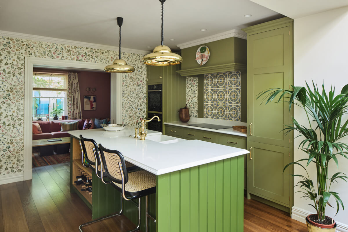 green-kitchen-with-island-floral-wallpaper