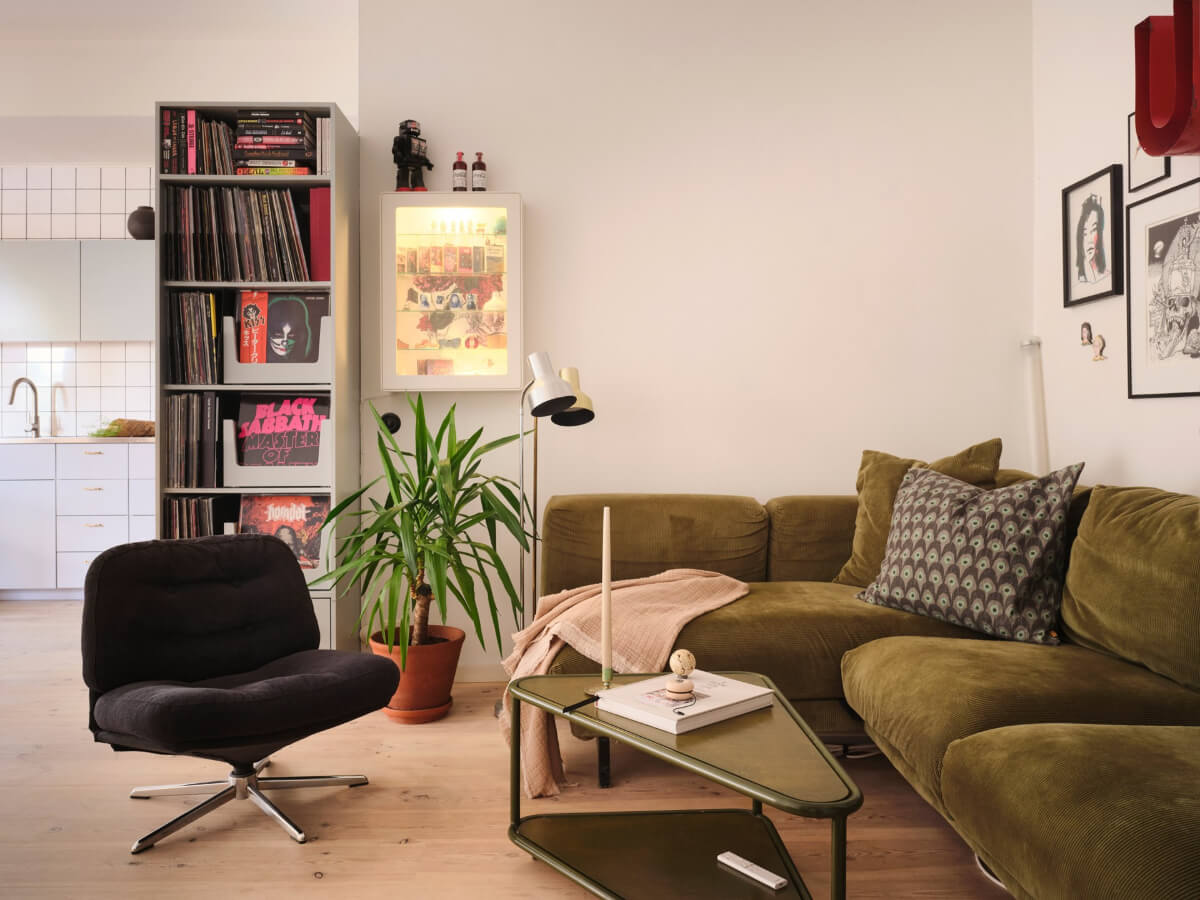 green sofa open-plan living space scandi home