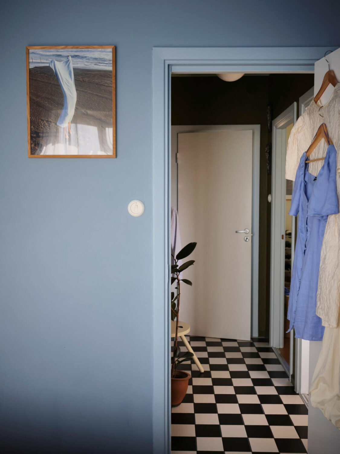 A 1940s Swedish Apartment with a Soft Yellow Kitchen 18 hall checkerboard floor