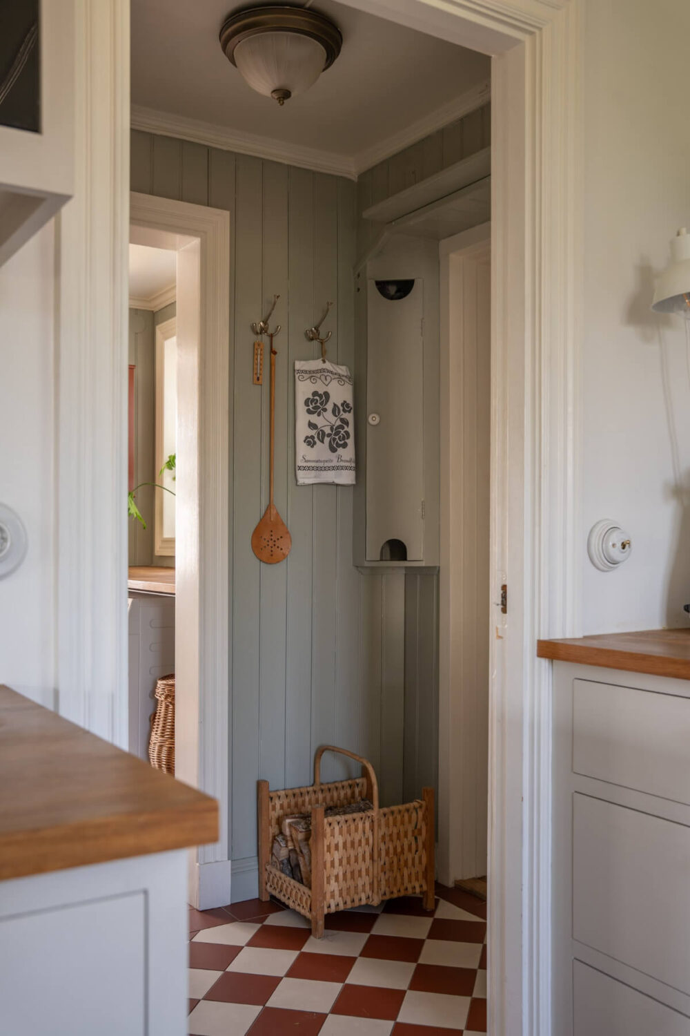 A Charming Historic Country House North of Stockholm 21 hall red and white checkerboard floor