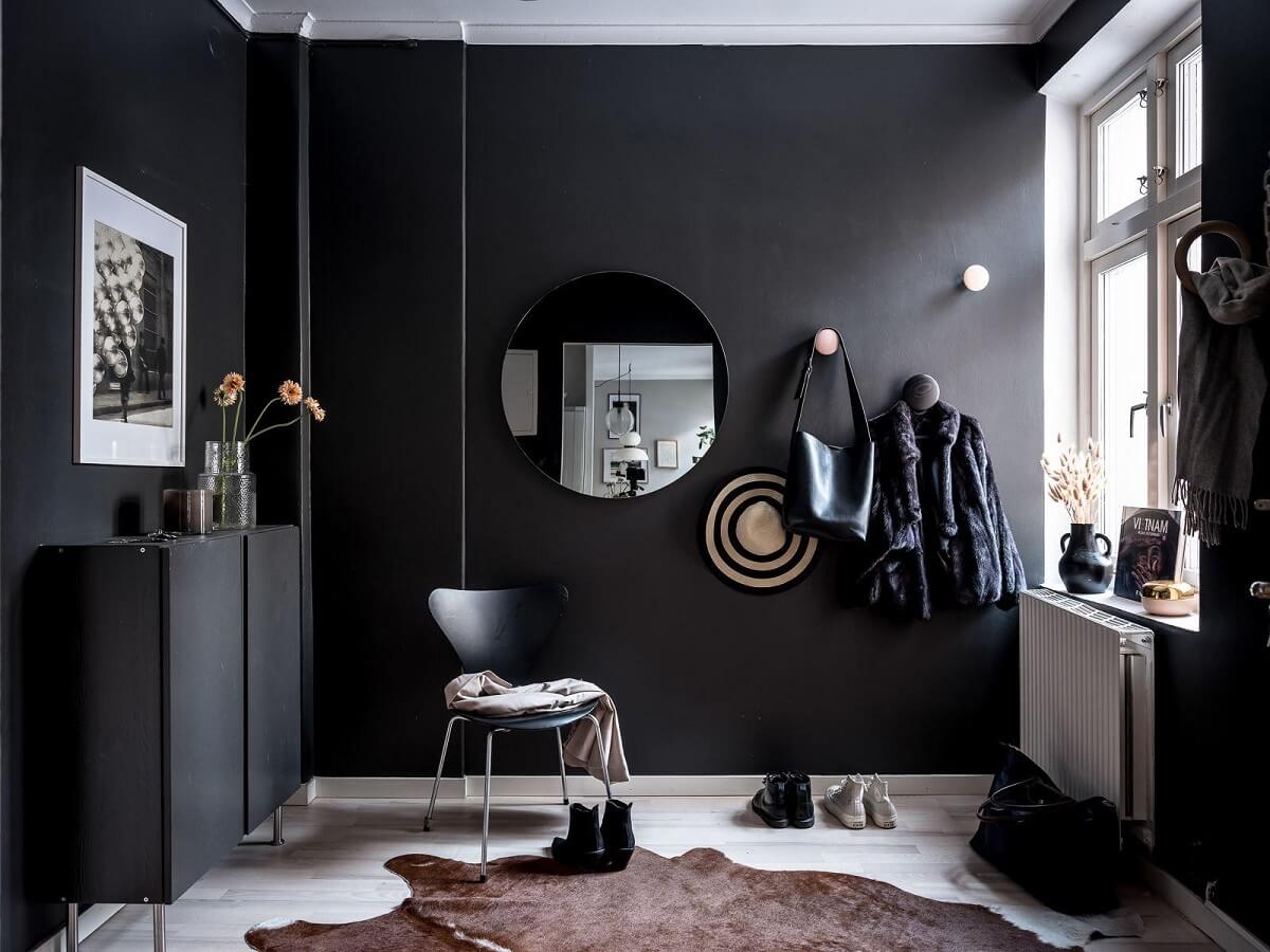 A Cozy Monochrome Gray Studio Apartment 21 hallway black walls round mirror nordroom