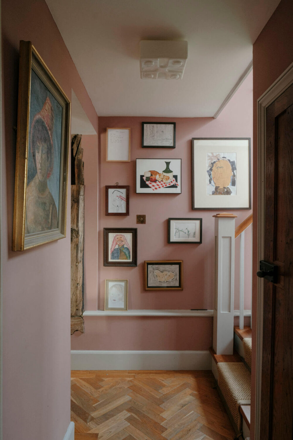 A Barn House with Vintage Decor and Exposed Beams 21 hallway with pink walls