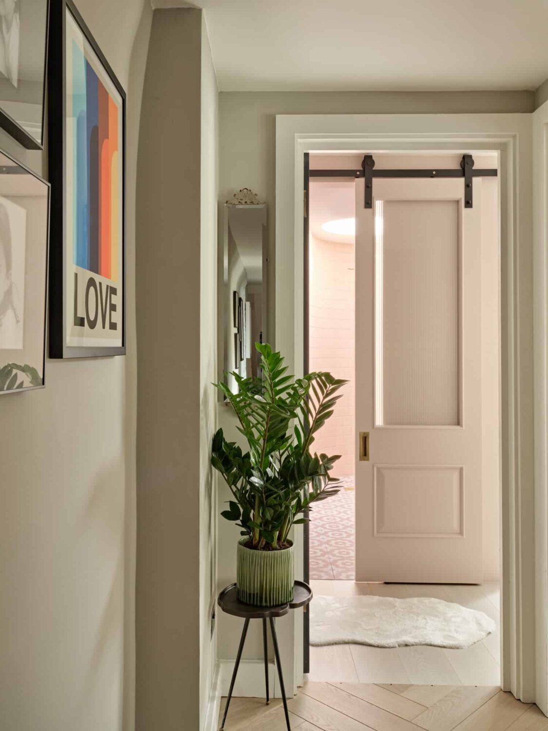Pink & Gray Rooms in a Victorian Home with a Guest House 14 hallway with sliding barn door