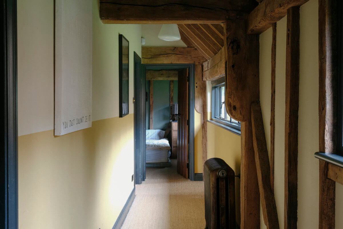 A Barn House with Vintage Decor and Exposed Beams 30 hallway with wooden beams