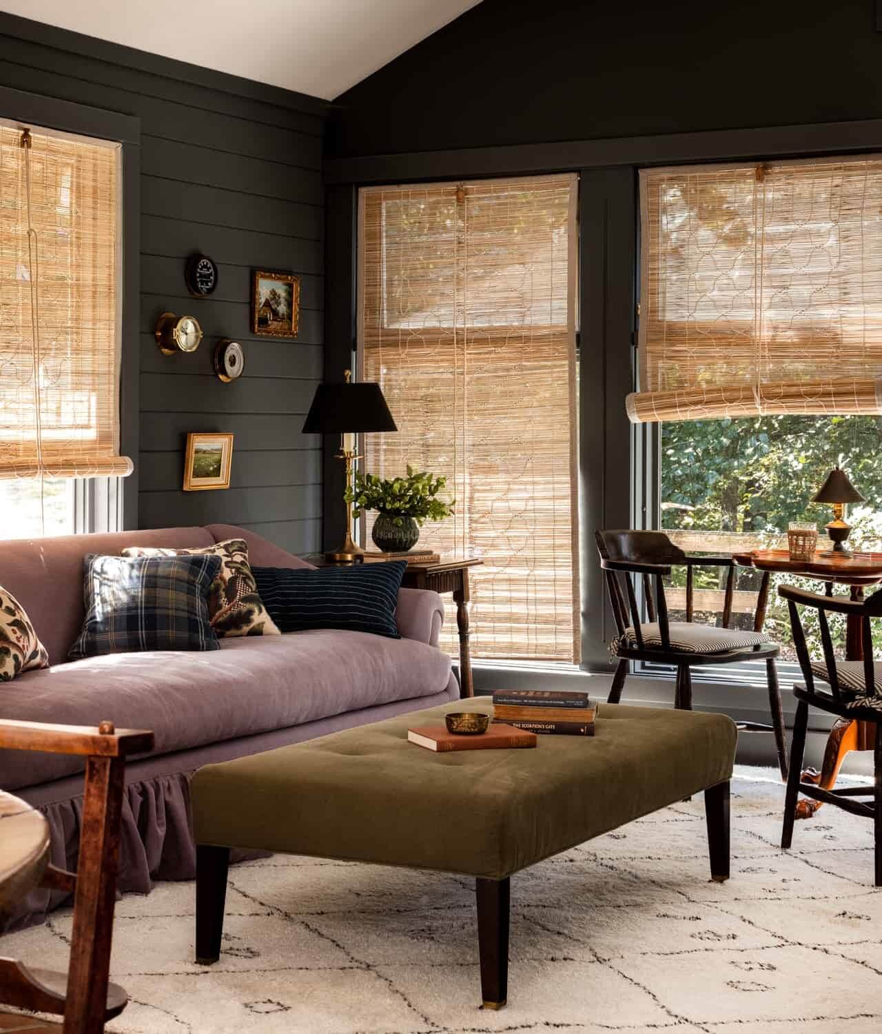The Color Trends for 2025: Warm, Natural Shades and a Cheerful Accent 50 Heidi-Caillier-Design-CT-country-house-Dutchess-County-design-sunroom-dark-paint-indian-chx-blinds-purple-sofa-Nordroom
