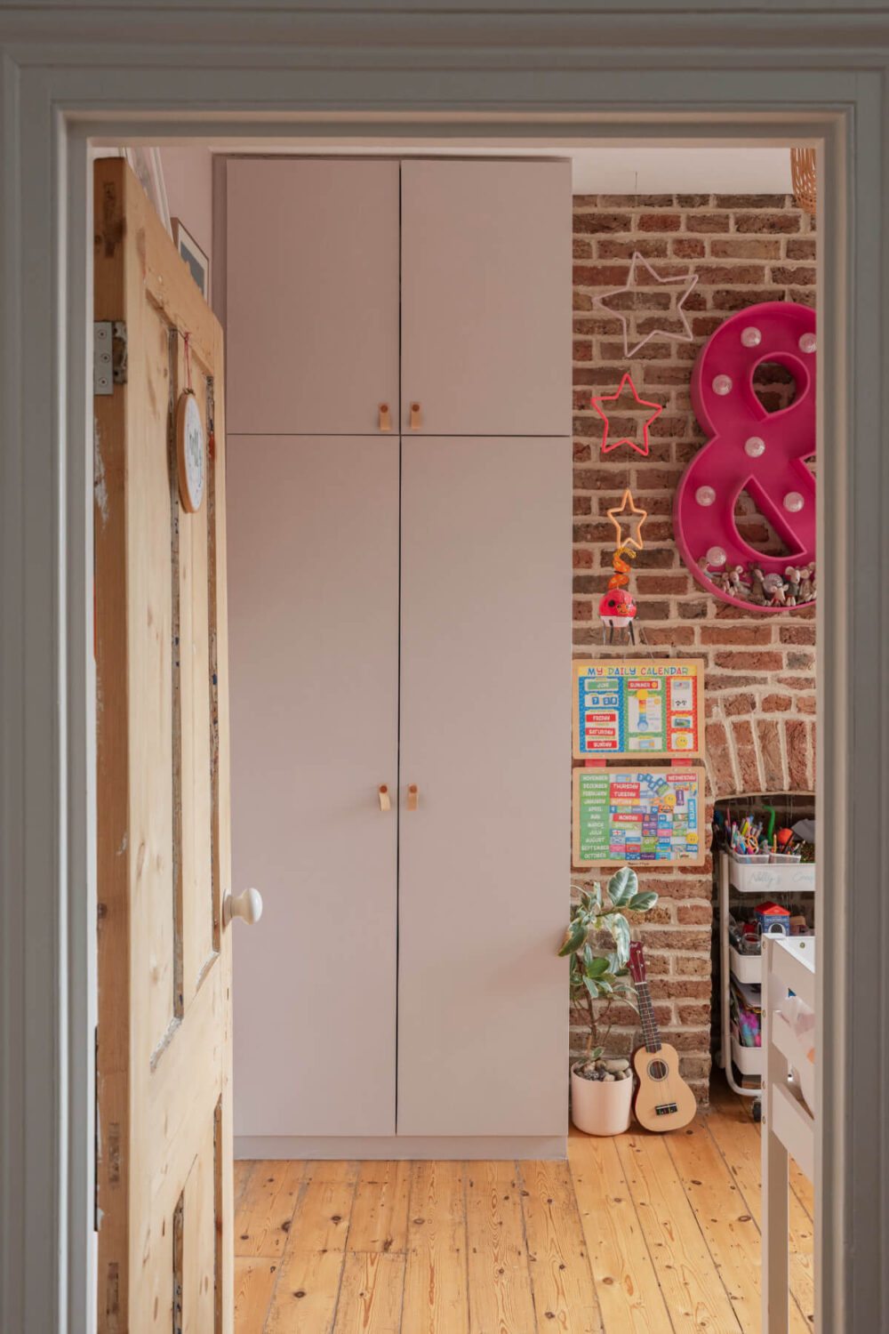 Exposed Brick and Wooden Beams in an Extended London Home 24 kids bedroom exposed brick pink wardrobe