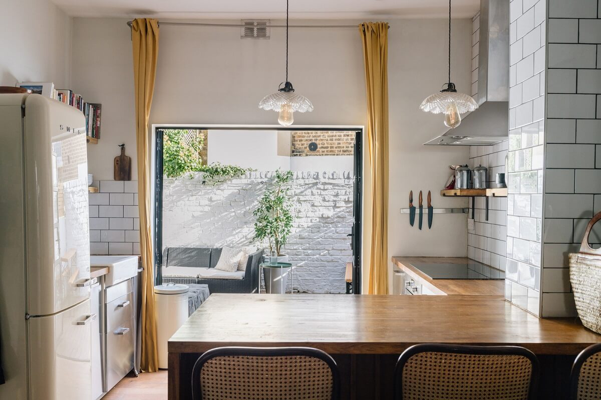 A Charming One-Bedroom Apartment with a Courtyard Terrace 5 kitchen bar seating white tiles