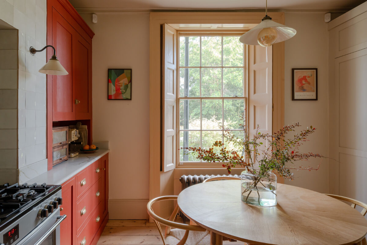 Vibrant Colors in a 19th-Century Regency Townhouse in England 3 kitchen butter yellow window frame round dining table