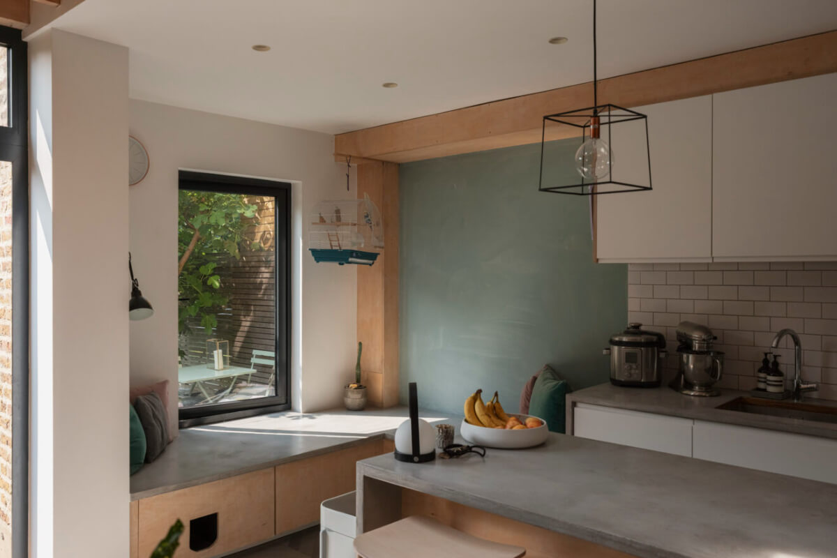 Exposed Brick and Wooden Beams in an Extended London Home 11 kitchen corner built-in bench