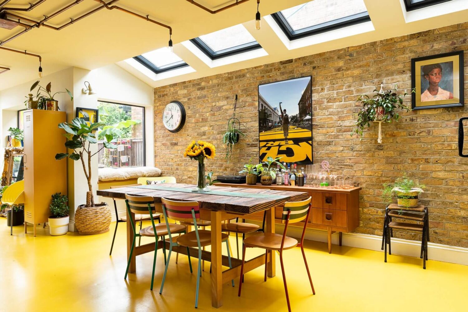 Yellow Kitchen Design Ideas (with Paint Colors) 57 kitchen-dining-room-brick-wall-skylights-yellow-floor-nordroom