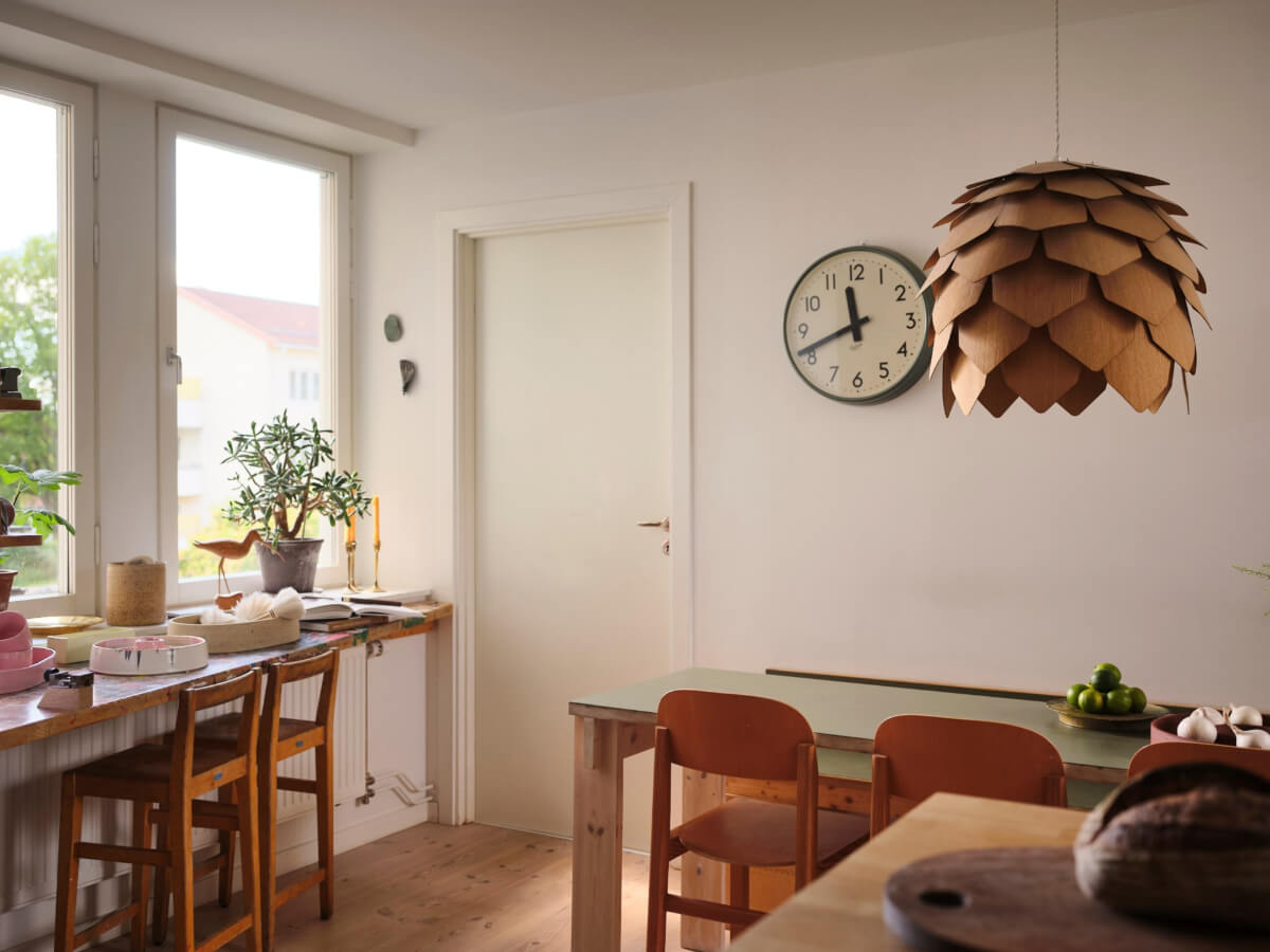 A Bright Family Apartment in a 1950s School Building 12 kitchen-dining-space-and-bar-table-under-window