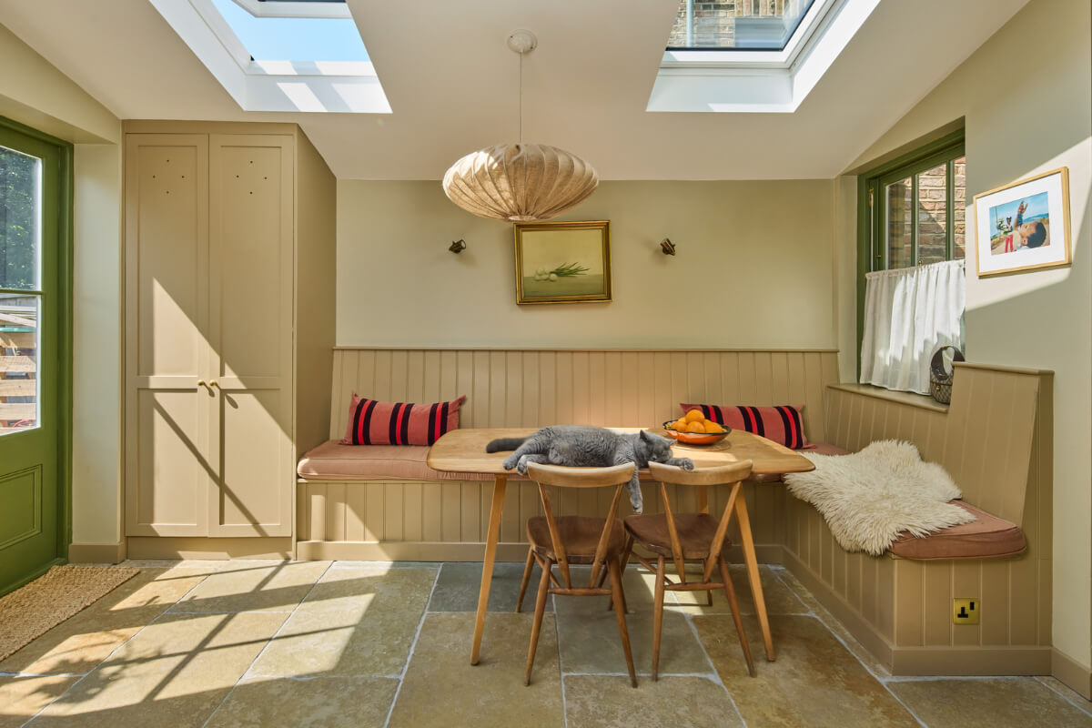 A 19th Century London Cottage with a Stunning Kitchen Extension 10 kitchen dining space with cat on table