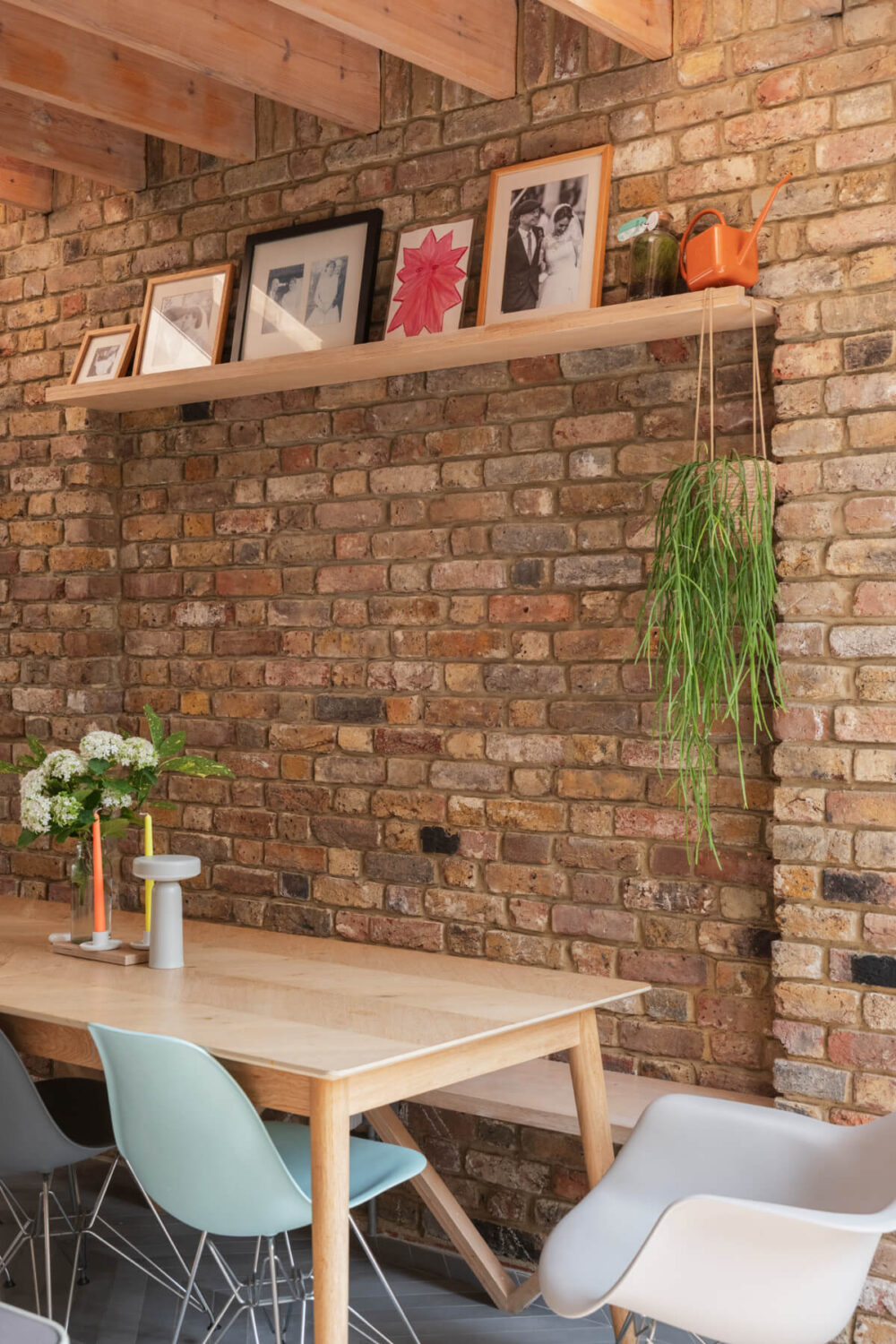 Exposed Brick and Wooden Beams in an Extended London Home 14 kitchen dining table with bench exposed brick wall