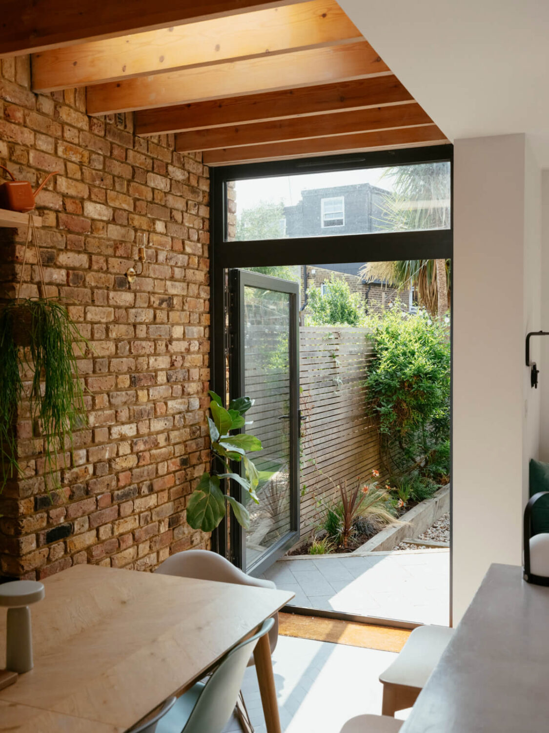 Exposed Brick and Wooden Beams in an Extended London Home 15 kitchen extension exposed brick wall garden doors