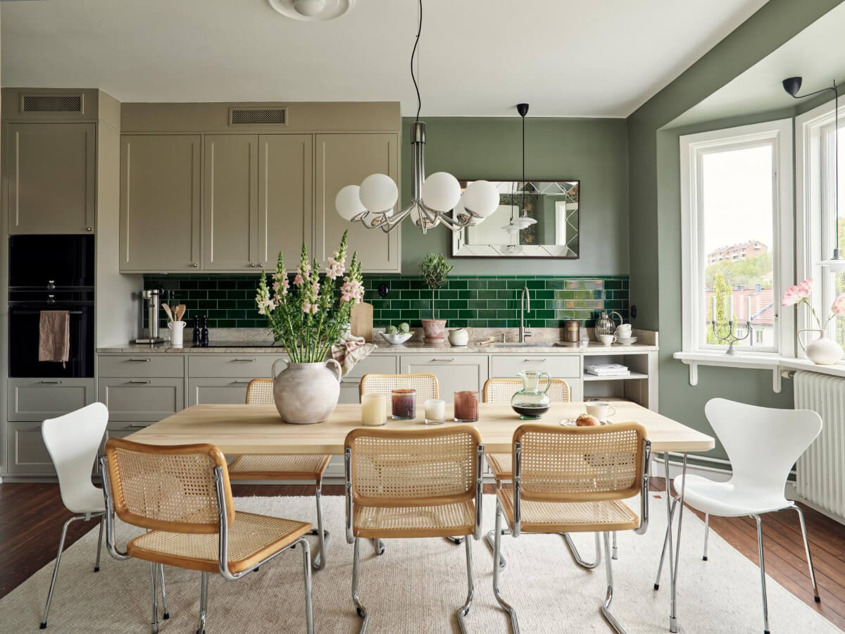 kitchen large dining table green backsplash tiles