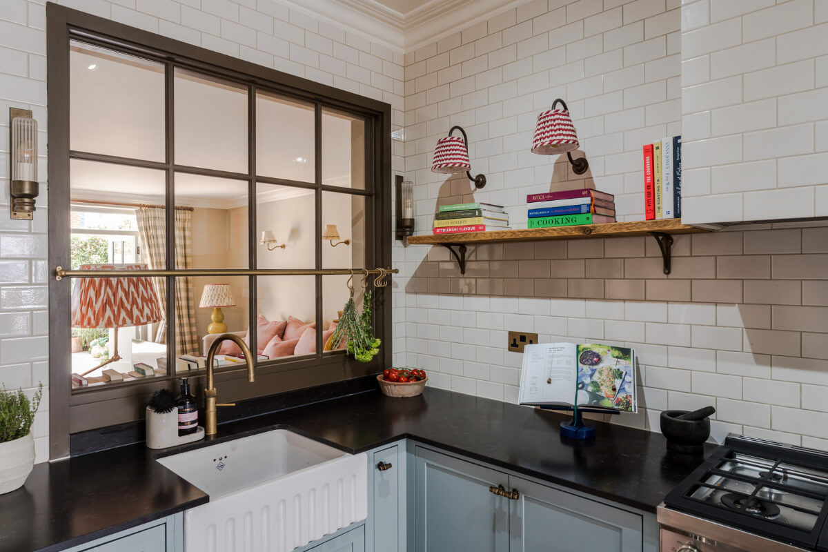 Color, Pattern, and Texture in a Renovated London Townhouse 7 kitchen light blue cabinets inner window to living room