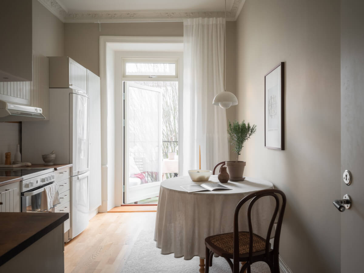 A 19th Century Apartment with a Dark Glass Room Divider 8 kitchen round table