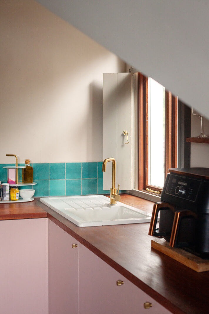 Pastel Tones and Midcentury Design in a Top Floor London Apartment 5 kitchen sink brass fittings