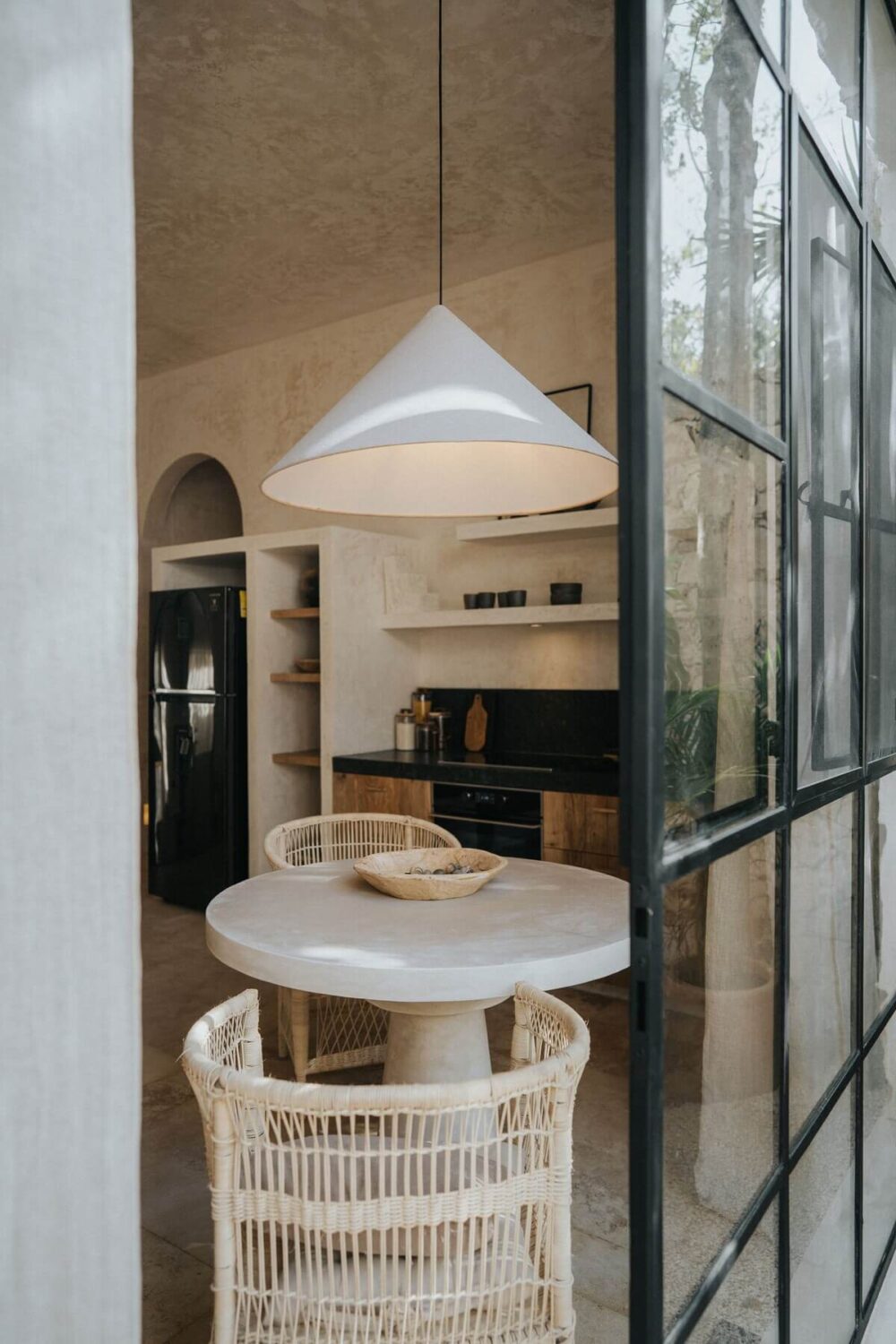 A Serene Design Apartment in Tulum 20 kitchen-small-dining-table-wicker-chairs-nordroom