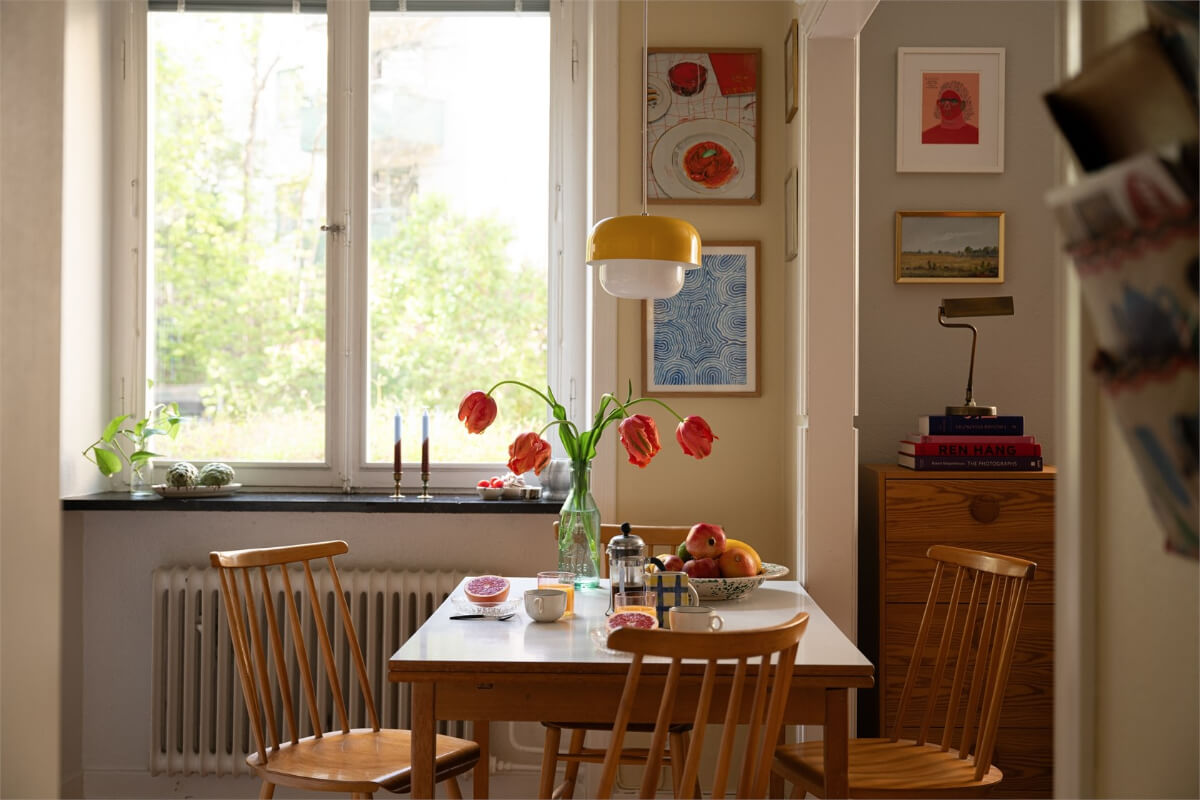 Midcentury Design and Colorful Decor in a Charming Studio Apartment 16 kitchen table yellow pendant Midcentury Design and Colorful Decor in a Charming Studio Apartment