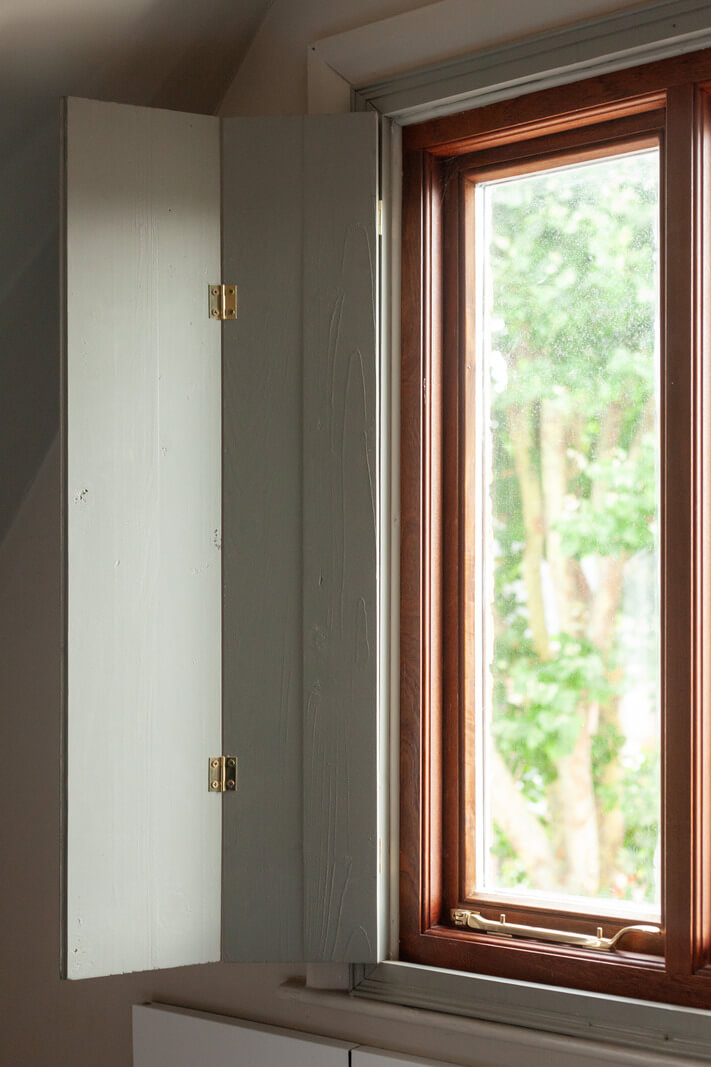 Pastel Tones and Midcentury Design in a Top Floor London Apartment 4 kitchen window shutters