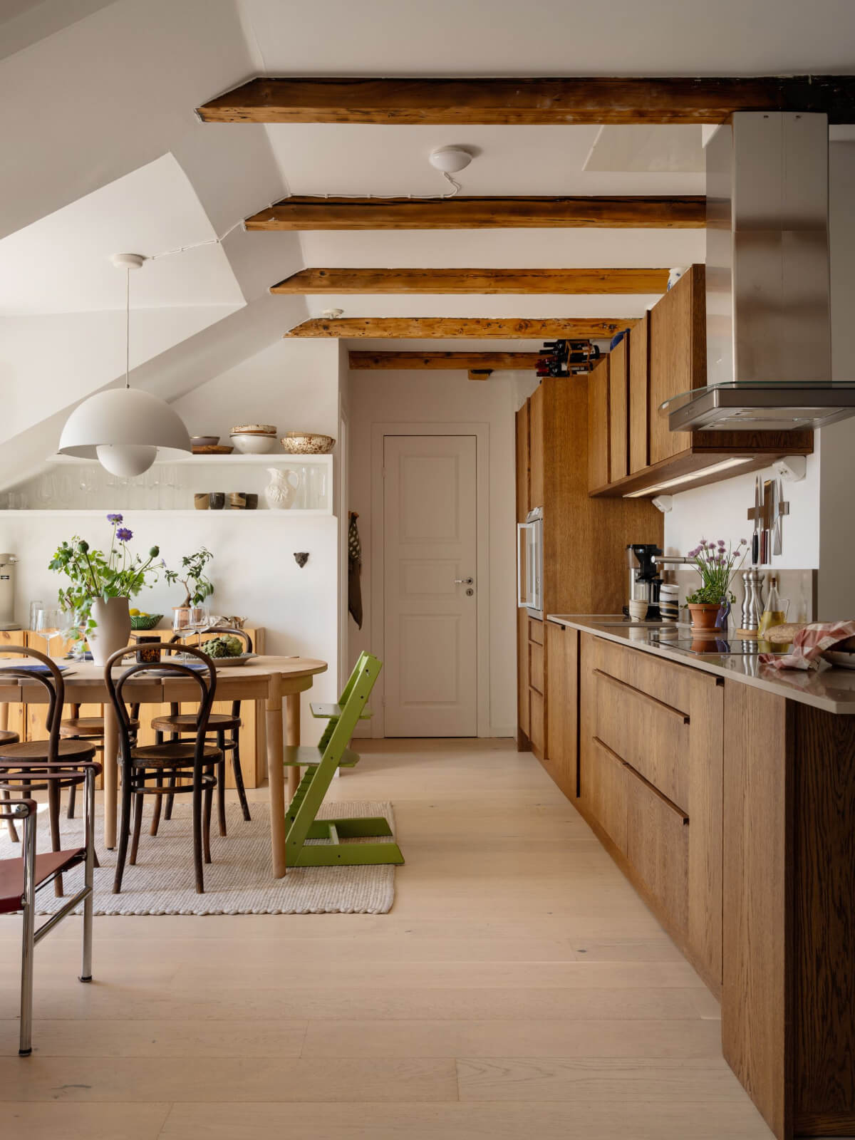 kitchen with dining table in stockholm attic apartment