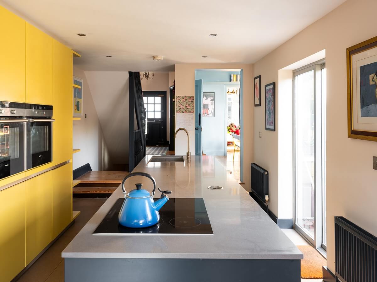 kitchen-with-yellow-floor-to-ceiling-cabinets-nordroom