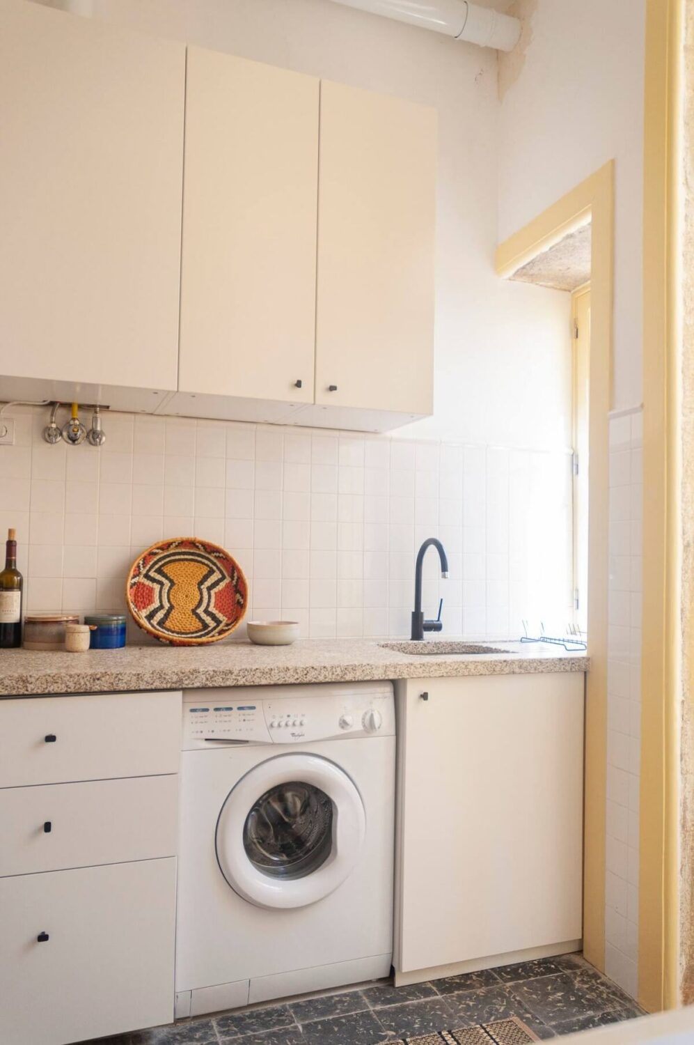 A Colorful Airbnb Apartment in Portugal 10 kitchen yellow doorframes