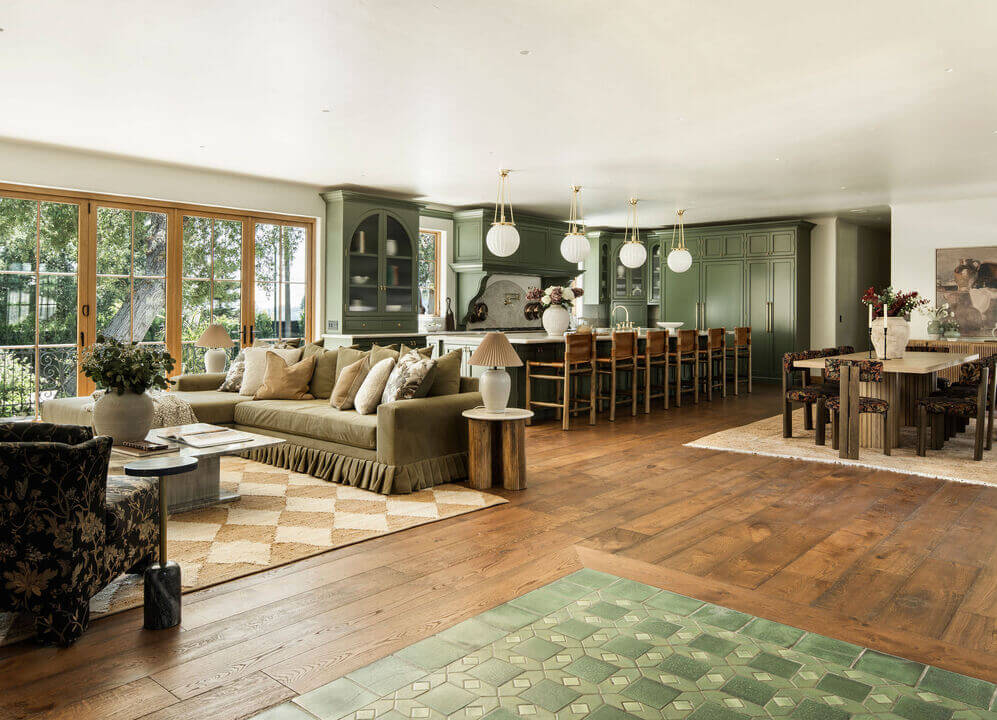 large open-plan living space green kitchen dining area
