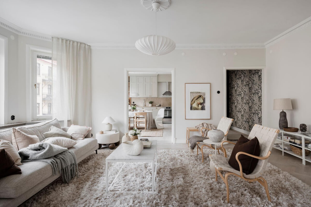 A Light Corner Apartment with an Open Flowing Floor Plan 19 large rug light living room bay window