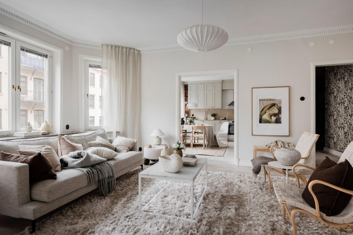 A Light Corner Apartment with an Open Flowing Floor Plan 20 light apartment large rug kitchen