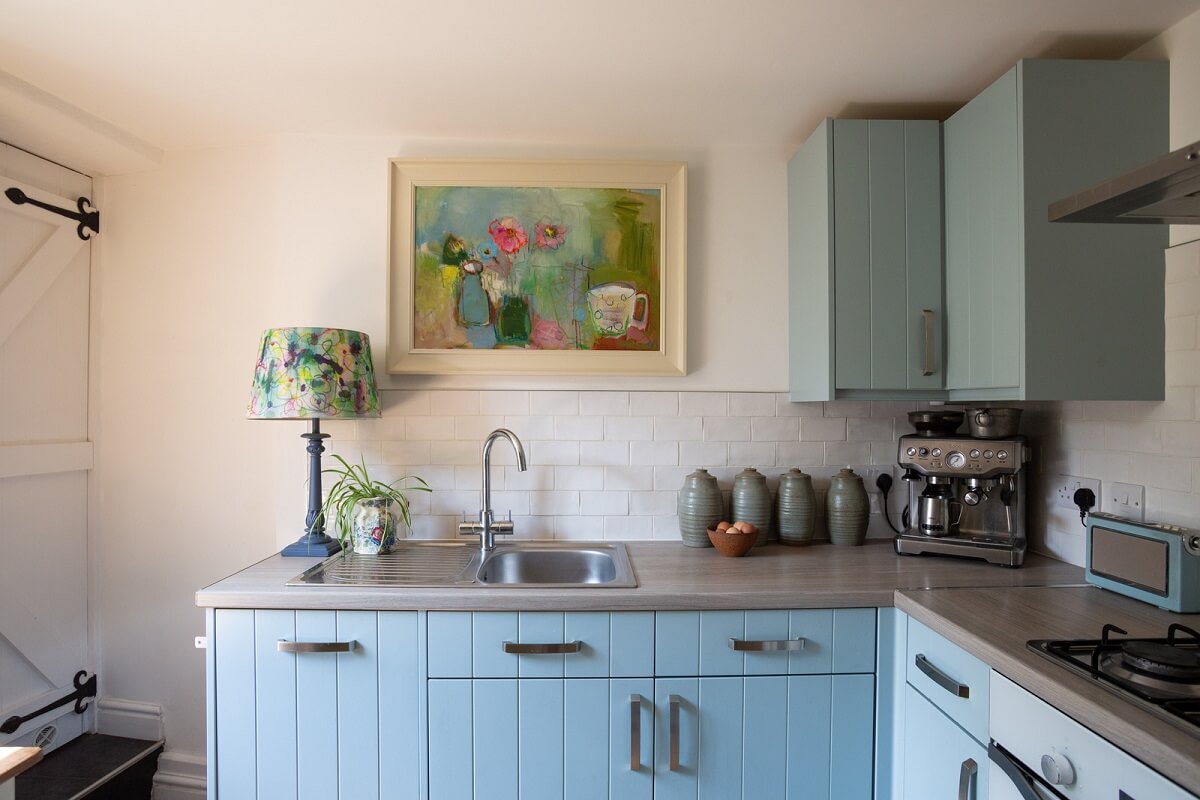 A Charming 400-Year-Old Cottage in England 10 light-blue-kitchen-cabinets.jpg