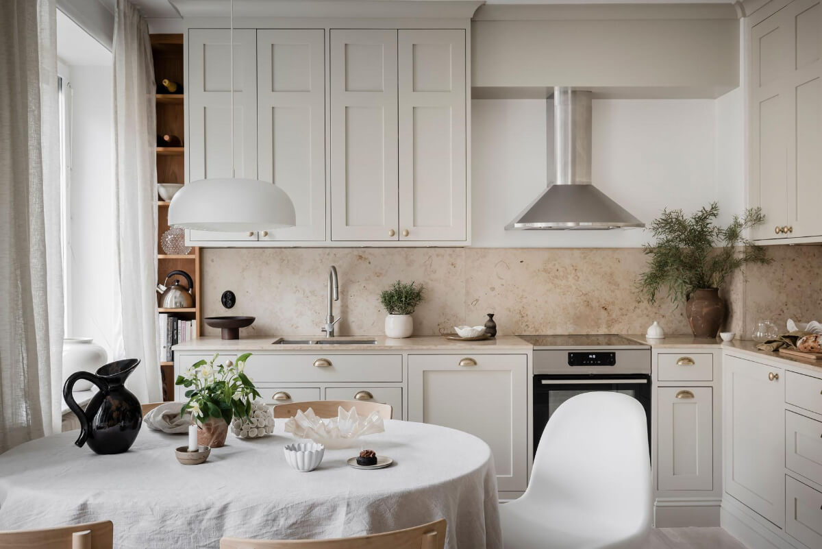 A Light Corner Apartment with an Open Flowing Floor Plan 9 light classic kitchen brass knobs open cabinet