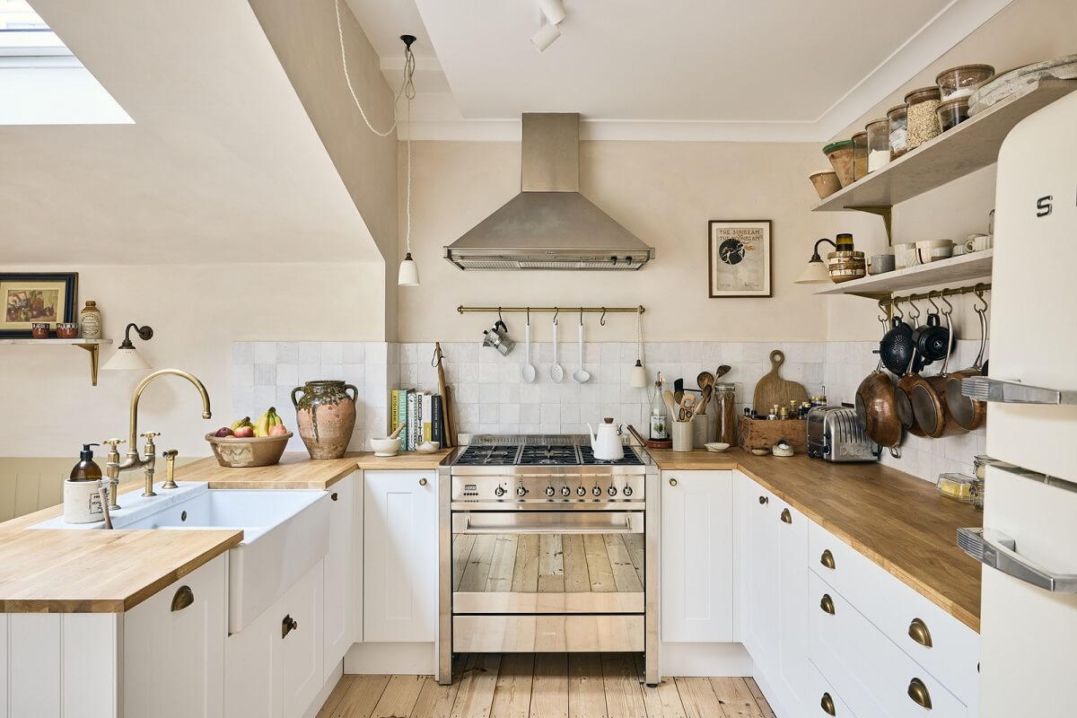 The Pros and Cons of a Wooden Kitchen Countertop 19 light cottage style kitchen with wooden worktop and shelves