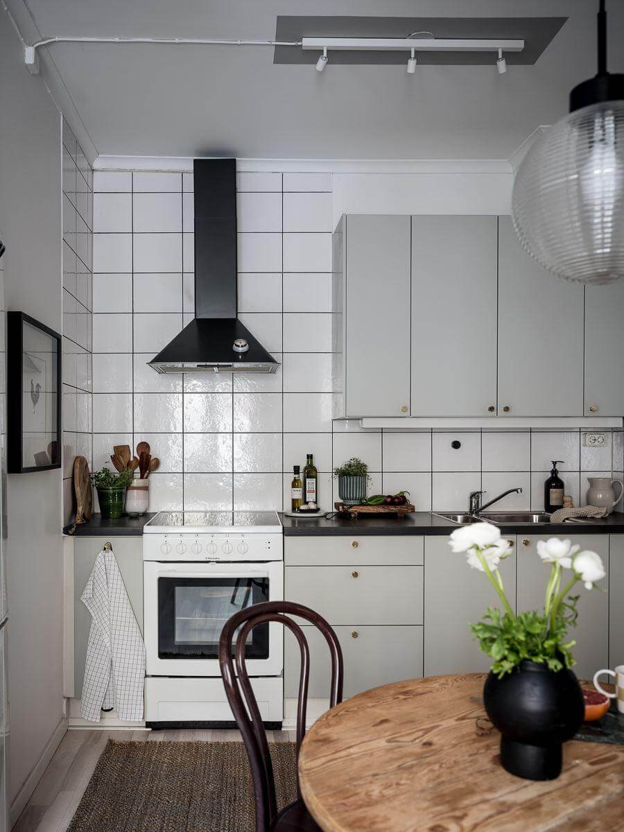 A Cozy Monochrome Gray Studio Apartment 15 light gray kitchen cabinets