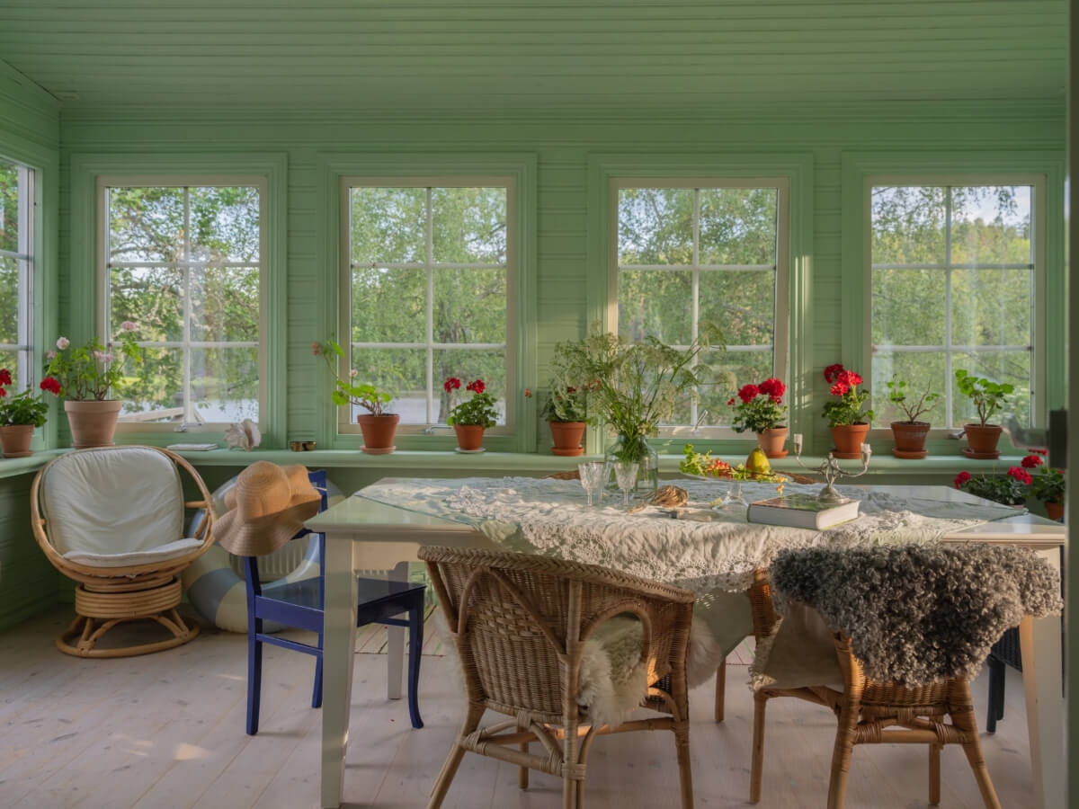 A 1930s Lakeside Country House with a Private Beach 3 light green garden room