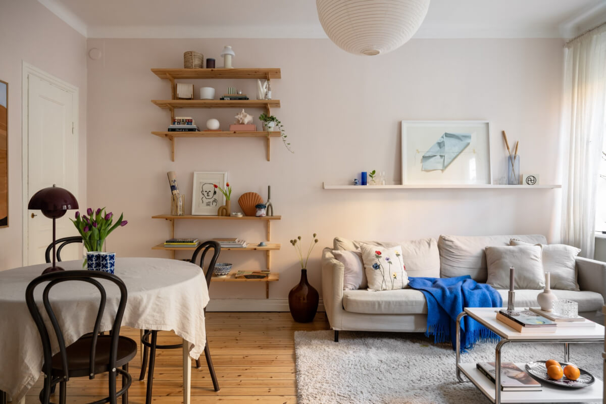 A Small Swedish Apartment with a Light Pink Living Room 6 light pink living room bookshelves